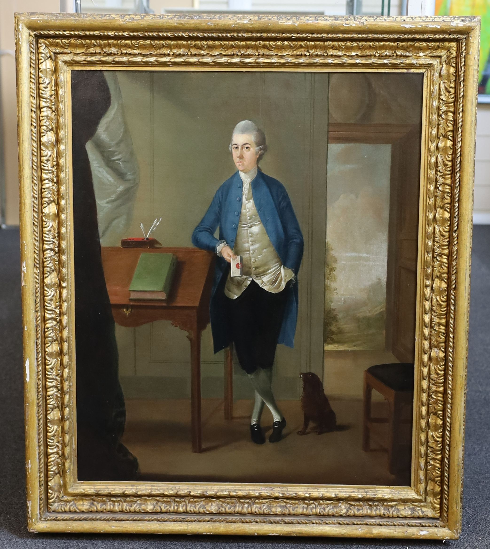 Attributed to James Millar (1735-1805), Full length portrait of a gentleman standing with his arm resting upon a bureau, holding a letter in one hand, a small dog at his feet, oil on canvas, 69 x 56cm